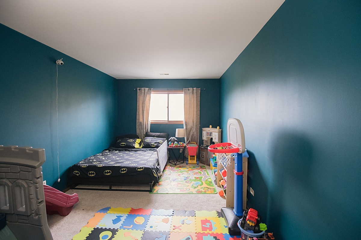 17297 Maple Lane Gurnee, IL 60031 - Photo 11 of 29 a bedroom with a bed and a window
