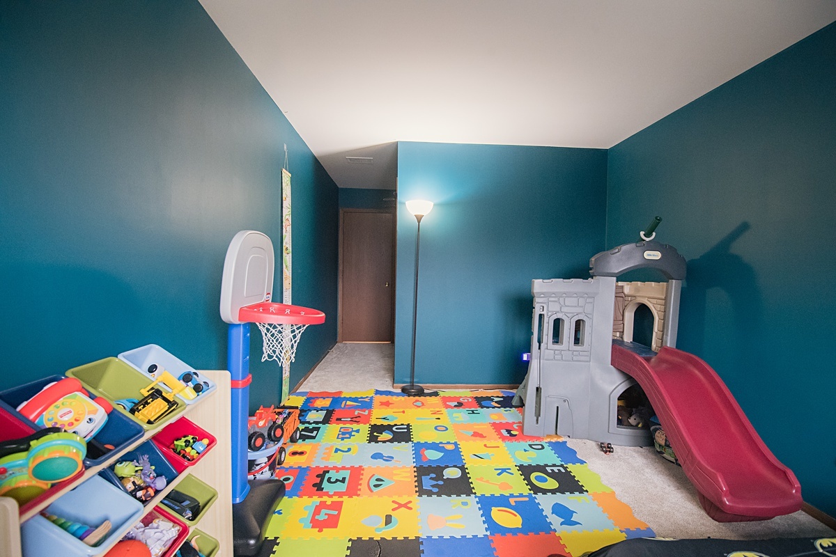 17297 Maple Lane Gurnee, IL 60031 - Photo 12 of 29 a bedroom with a bed and a wooden floor