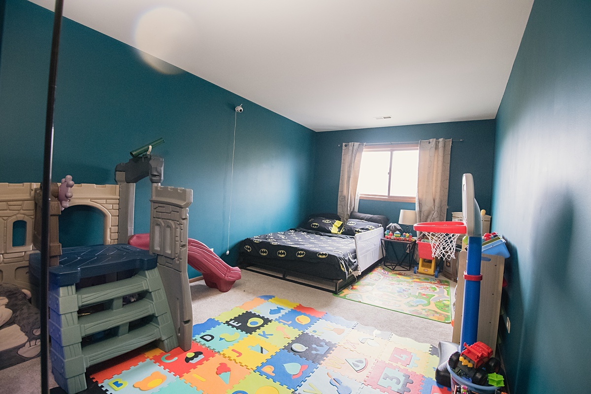 17297 Maple Lane Gurnee, IL 60031 - Photo 13 of 29 a bedroom with bed and a window
