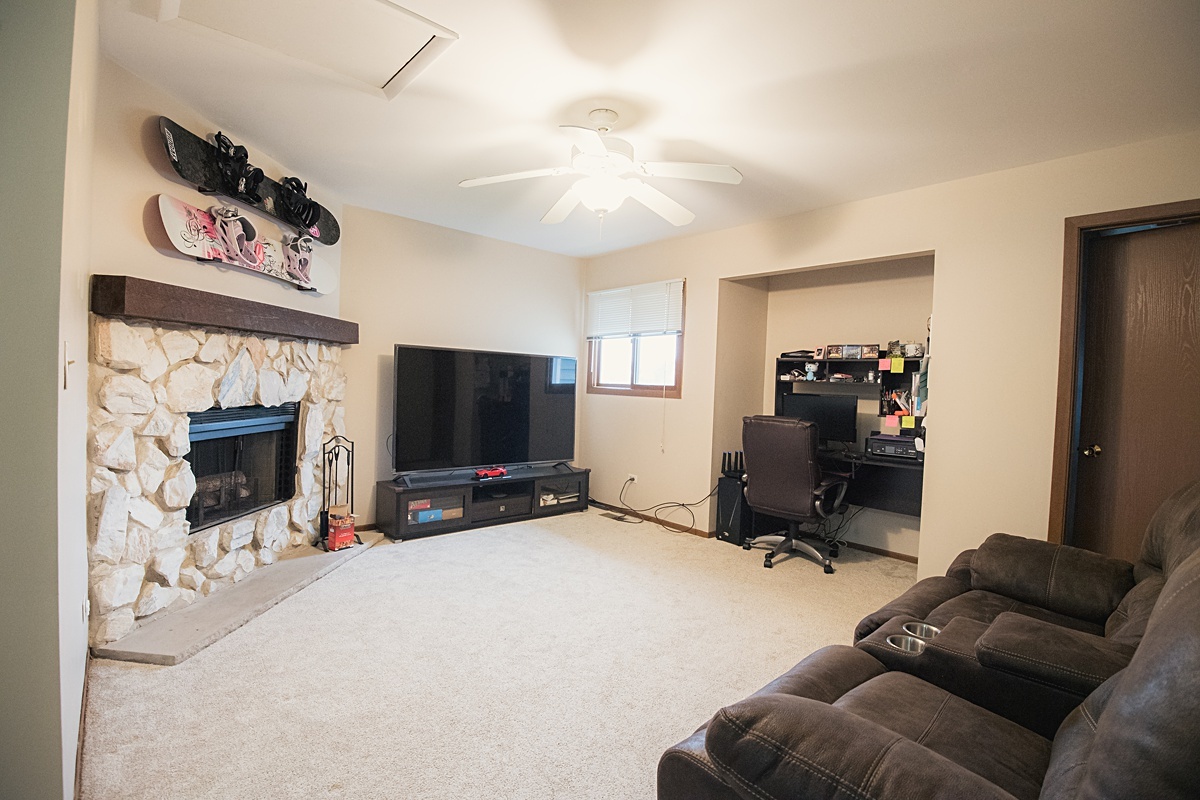 17297 Maple Lane Gurnee, IL 60031 - Photo 15 of 29 a living room with furniture and a flat screen tv