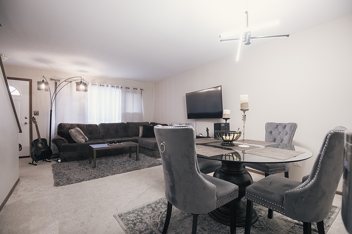 17297 Maple Lane Gurnee, IL 60031 - Photo 20 of 29 a view of a livingroom with furniture and a flat screen tv