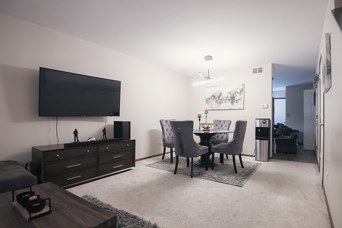 17297 Maple Lane Gurnee, IL 60031 - Photo 22 of 29 a view of a livingroom with furniture and a flat screen tv