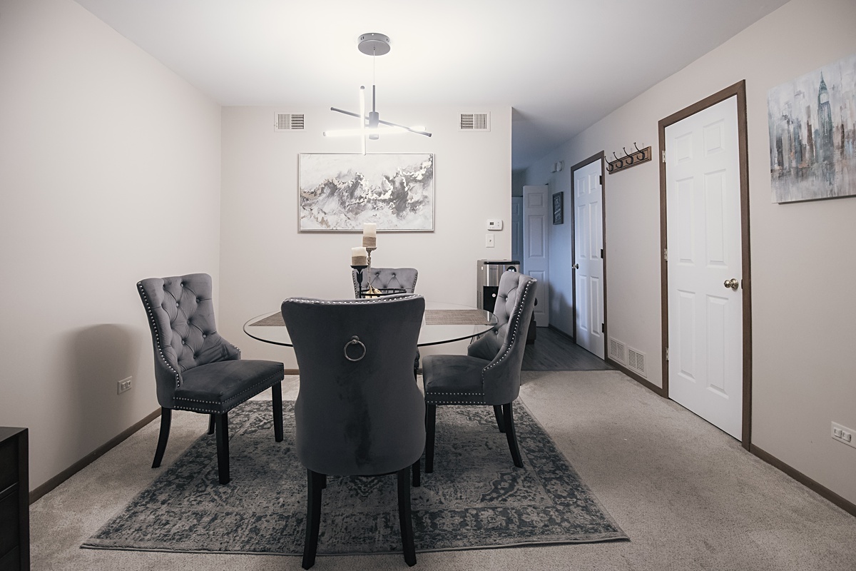17297 Maple Lane Gurnee, IL 60031 - Photo 23 of 29 a view of a dining room with furniture