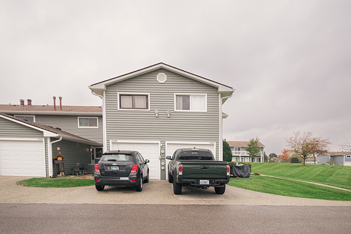 17297 Maple Lane Gurnee, IL 60031 - Photo 5 of 29 a car parked in front of a house