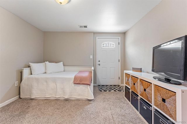 a room with furniture and flat screen tv