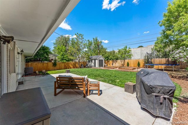 a view of a patio with a yard