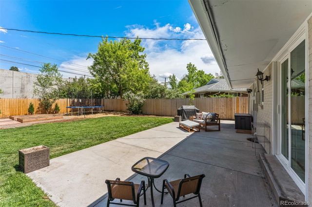 a view of yard with patio