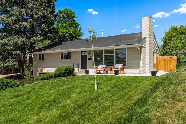 a front view of house with yard and patio