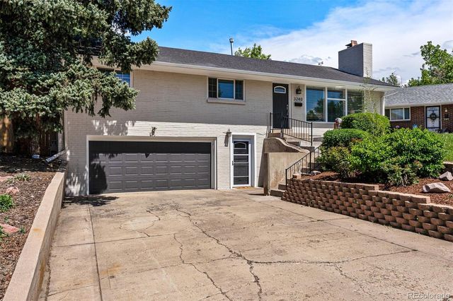 a front view of a house with yard