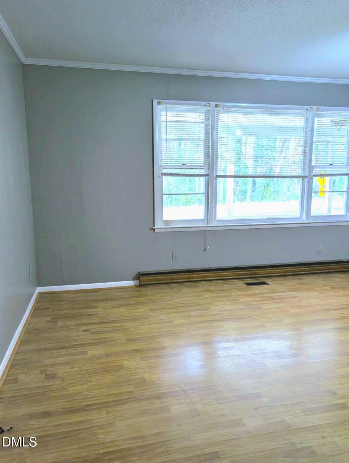 323 Ranch Farm Road Raleigh, NC 27603 - Photo 17 of 42 a view of an empty room with a window