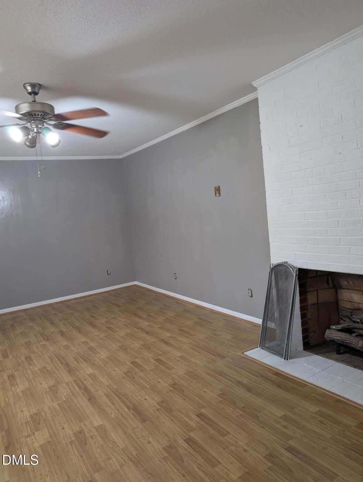 323 Ranch Farm Road Raleigh, NC 27603 - Photo 21 of 42 a view of an empty room with wooden floor and a window