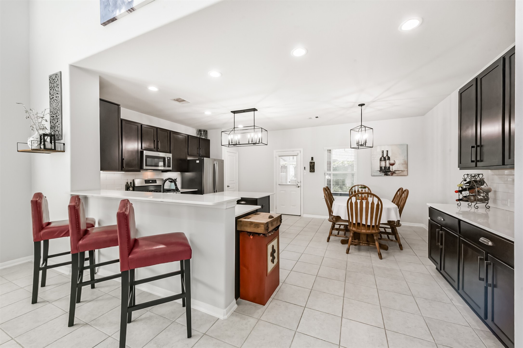 10018 Chase Court Baytown, TX 77521 - Photo 12 of 50 a kitchen with stainless steel appliances kitchen island granite countertop a sink and cabinets