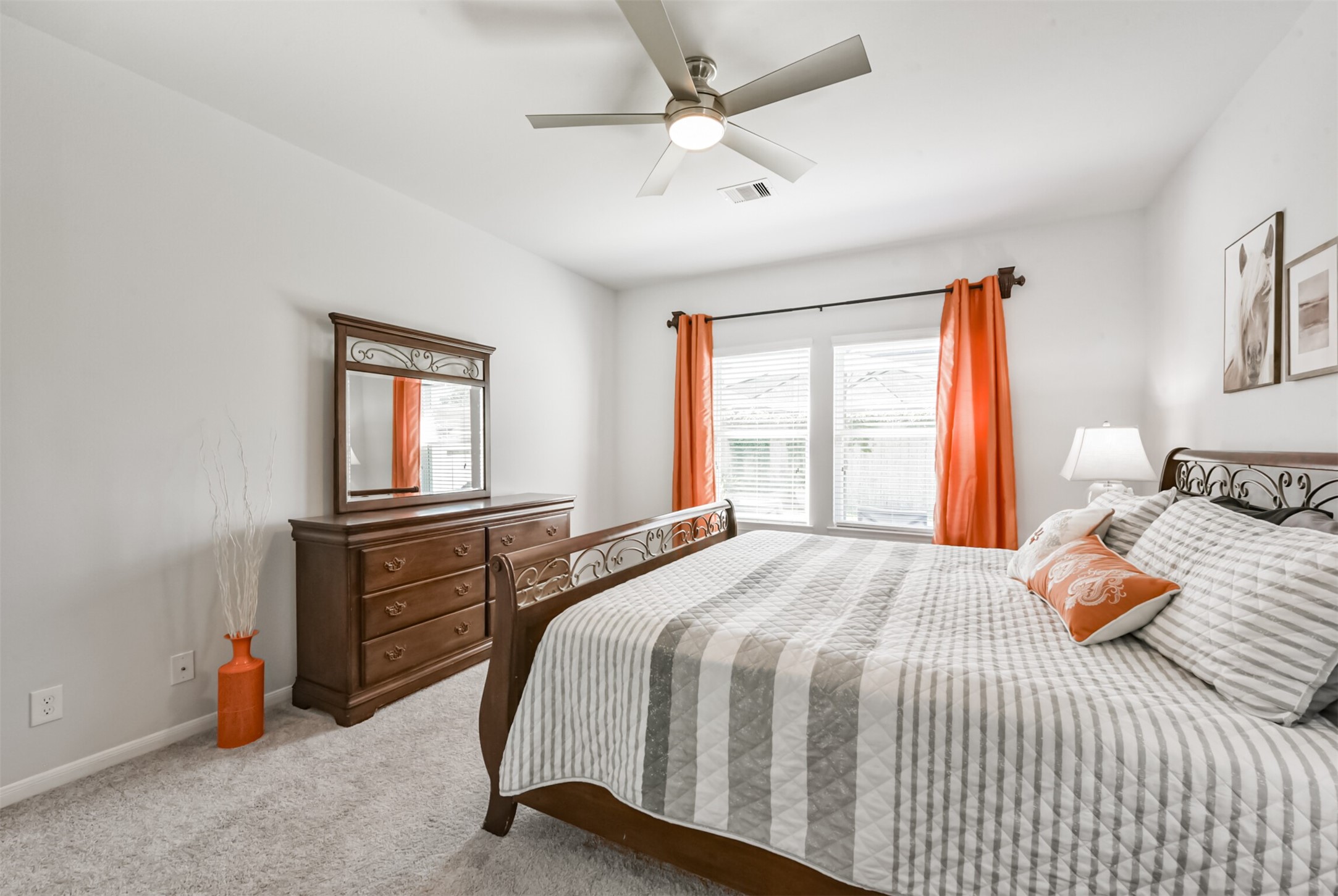 10018 Chase Court Baytown, TX 77521 - Photo 21 of 50 a bedroom with a bed and a chandelier