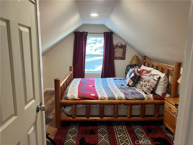 a bedroom with furniture and a window