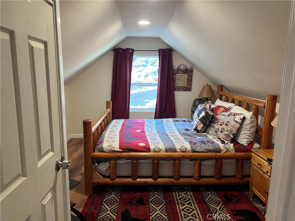 39307 Lark Road Big Bear Lake, CA 92315 - Photo 3 of 35 a bedroom with furniture and a window