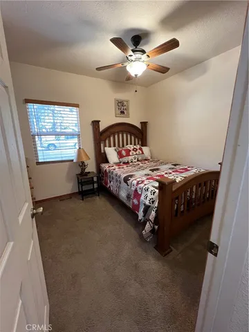 a bedroom with furniture and a chandelier
