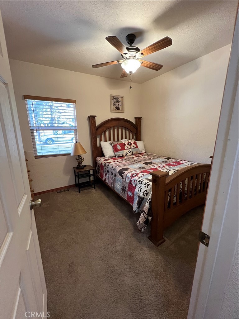 39307 Lark Road Big Bear Lake, CA 92315 - Photo 7 of 35 a bedroom with a bed and window