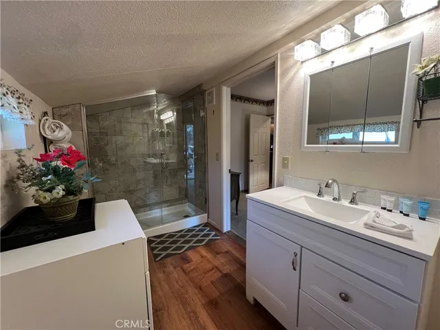 a view of bathroom with a sink and mirror