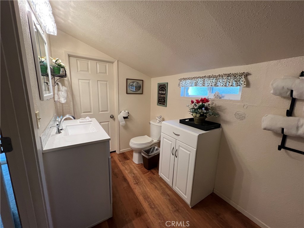 39307 Lark Road Big Bear Lake, CA 92315 - Photo 10 of 35 a view of bathroom with a sink and mirror