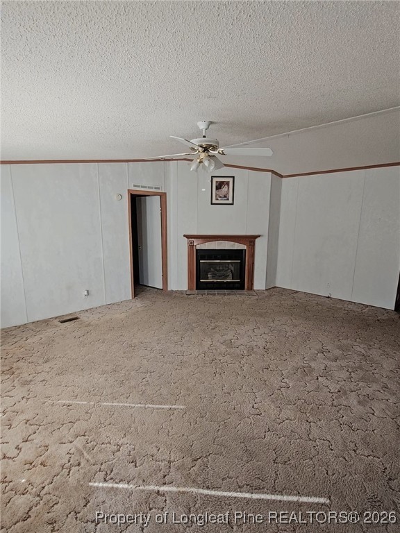 2156 Maxton Street Autryville, NC 28318 - Photo 2 of 38 an empty room with fireplace and a wooden floor