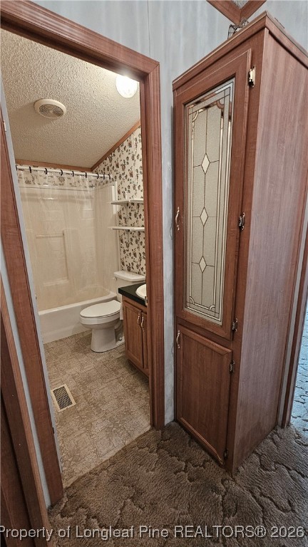 2156 Maxton Street Autryville, NC 28318 - Photo 23 of 38 a bathroom with a toilet a sink a mirror and shower