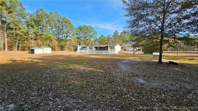 a view of a yard with a trees