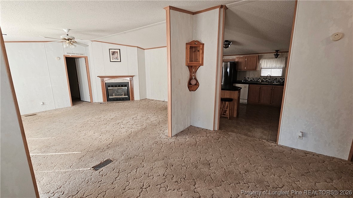 2156 Maxton Street Autryville, NC 28318 - Photo 8 of 38 a view of a kitchen with refrigerator cabinets and furniture