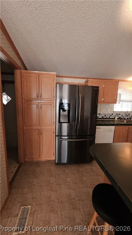 2156 Maxton Street Autryville, NC 28318 - Photo 10 of 38 a kitchen with stainless steel appliances granite countertop a refrigerator a stove and a sink