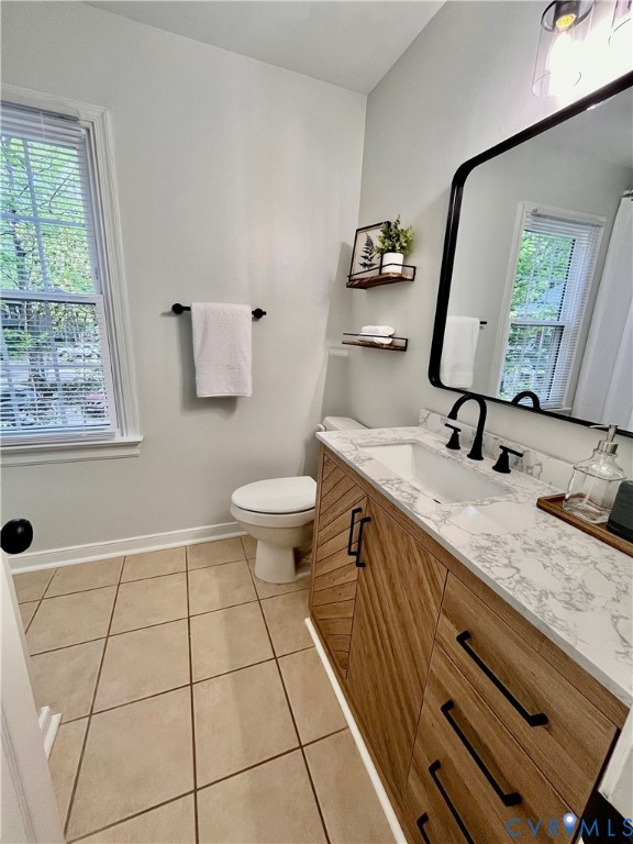 13700 Watkins Glen Road Midlothian, VA 23112 - Photo 16 of 23 a bathroom with a granite countertop sink a toilet and mirror