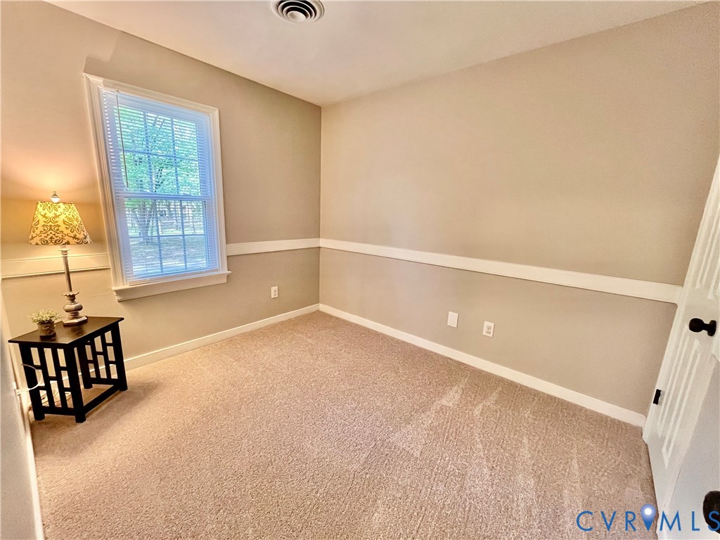 13700 Watkins Glen Road Midlothian, VA 23112 - Photo 17 of 23 an empty room with windows