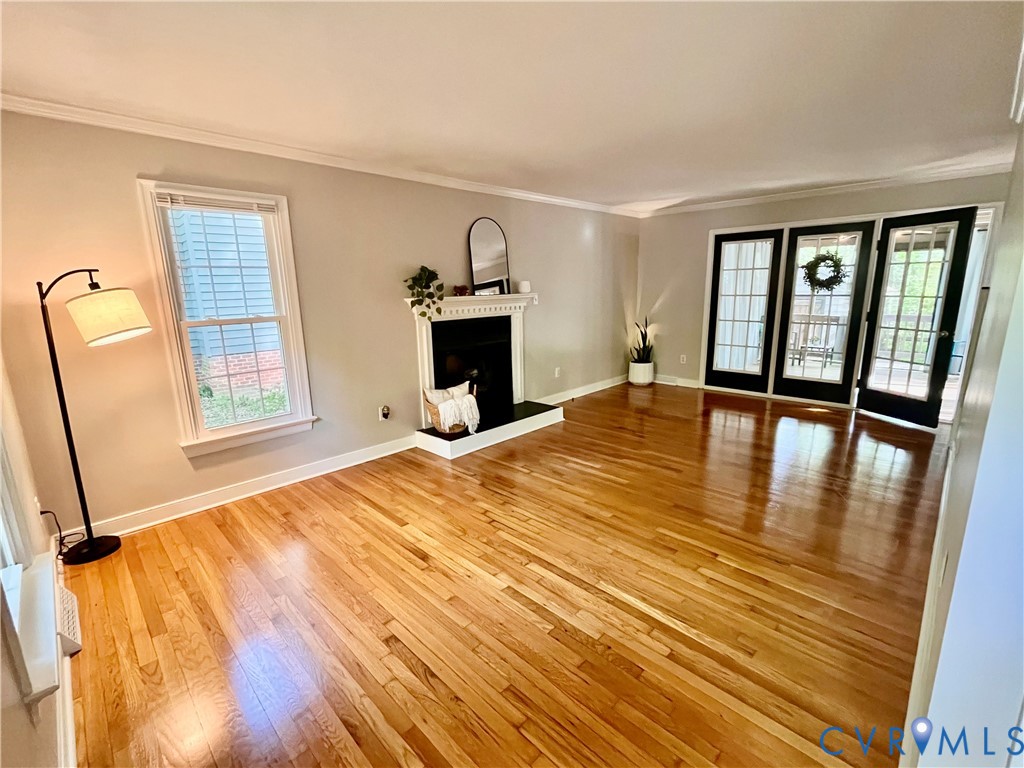 13700 Watkins Glen Road Midlothian, VA 23112 - Photo 2 of 23 a bedroom with a bed and wooden floor
