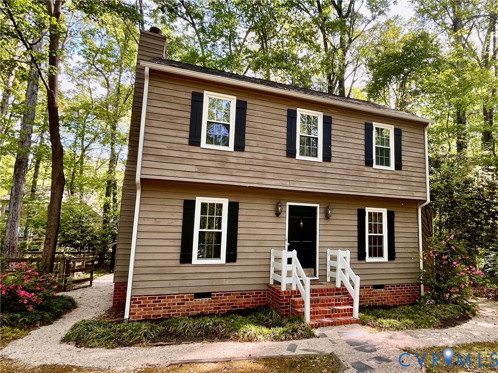 13700 Watkins Glen Road Midlothian, VA 23112 - Photo 22 of 23 a front view of a house with garden