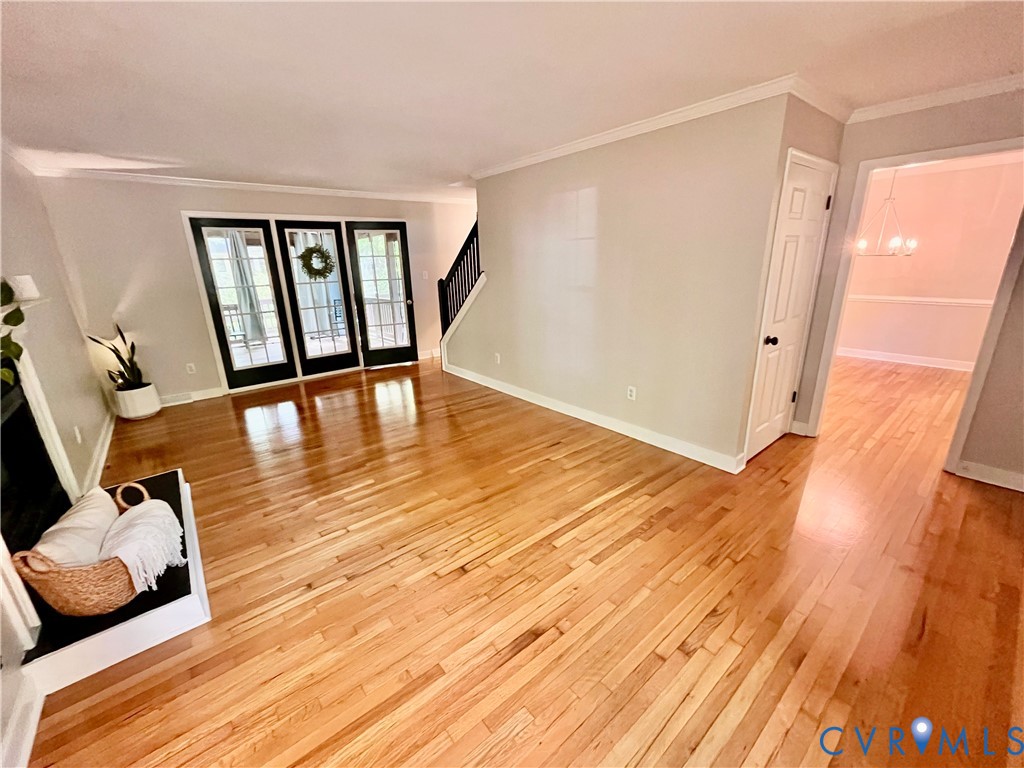 13700 Watkins Glen Road Midlothian, VA 23112 - Photo 3 of 23 a view of a room with wooden floor and chair