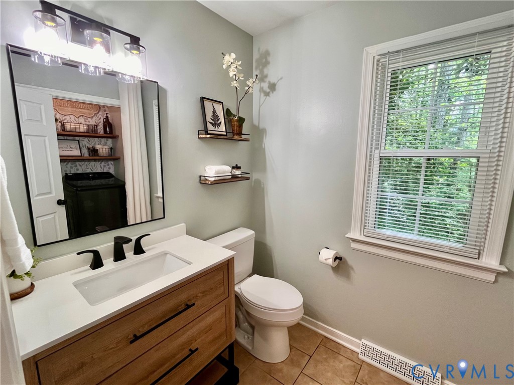 13700 Watkins Glen Road Midlothian, VA 23112 - Photo 10 of 23 a bathroom with a sink vanity granite and toilet