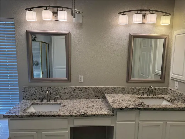 a bathroom with a sink and a vanity