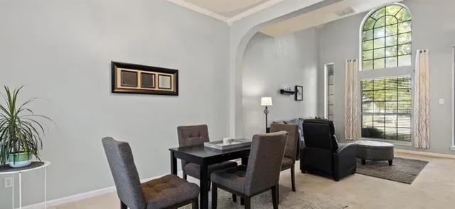 a view of a livingroom with furniture and a window