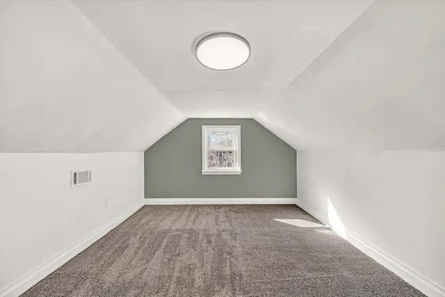 a view of a livingroom with stairs