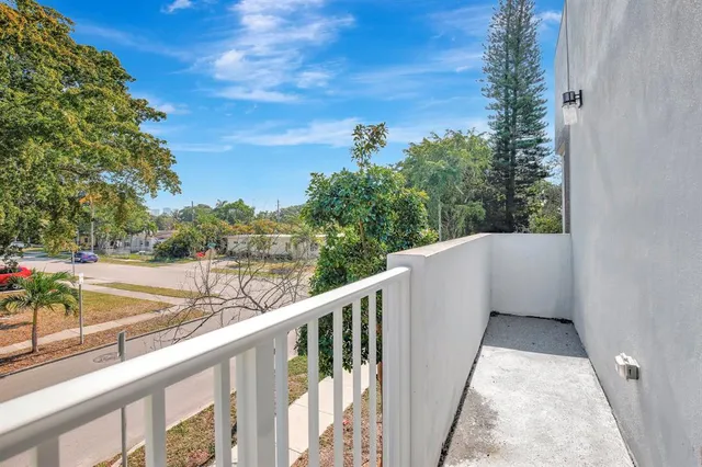 a view of a balcony with an outdoor space