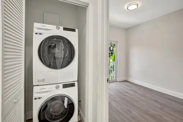 a view of a hallway with washer and dryer