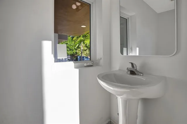 a bathroom with a sink and a mirror