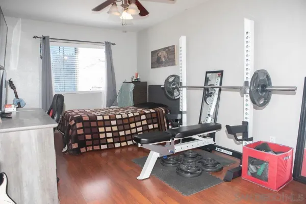 a bedroom with furniture and a window