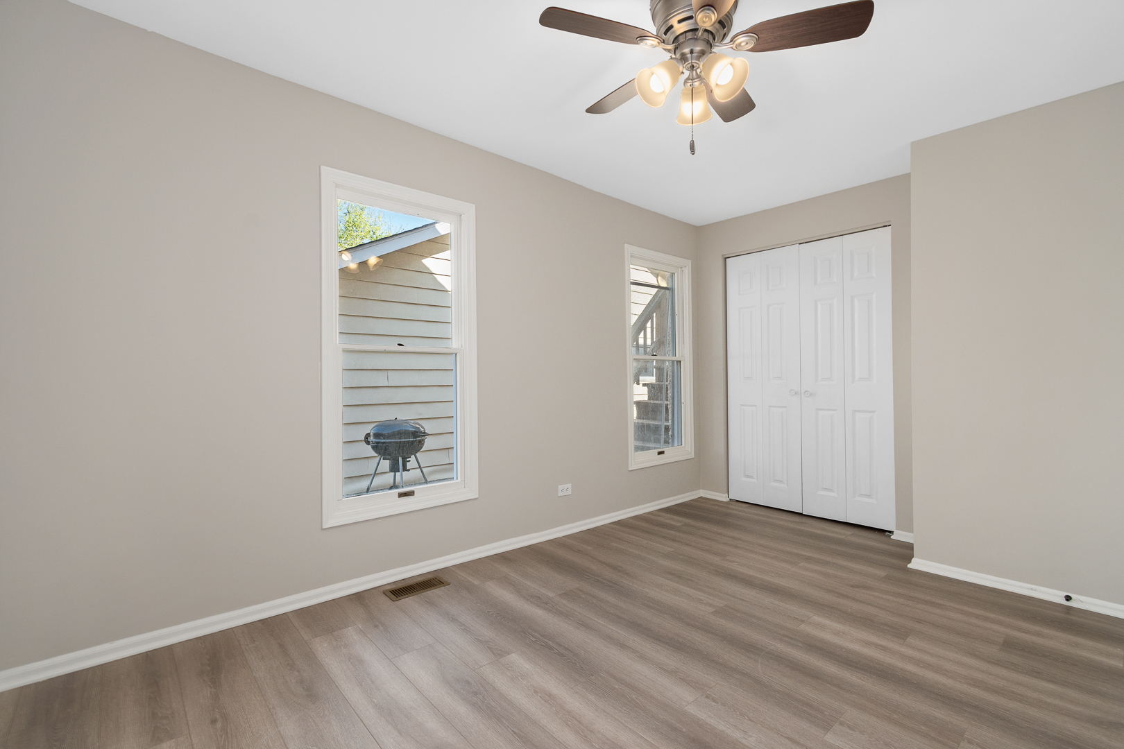 427 Delles Road Wheaton, IL 60187 - Photo 18 of 31 wooden floor in an empty room with a window