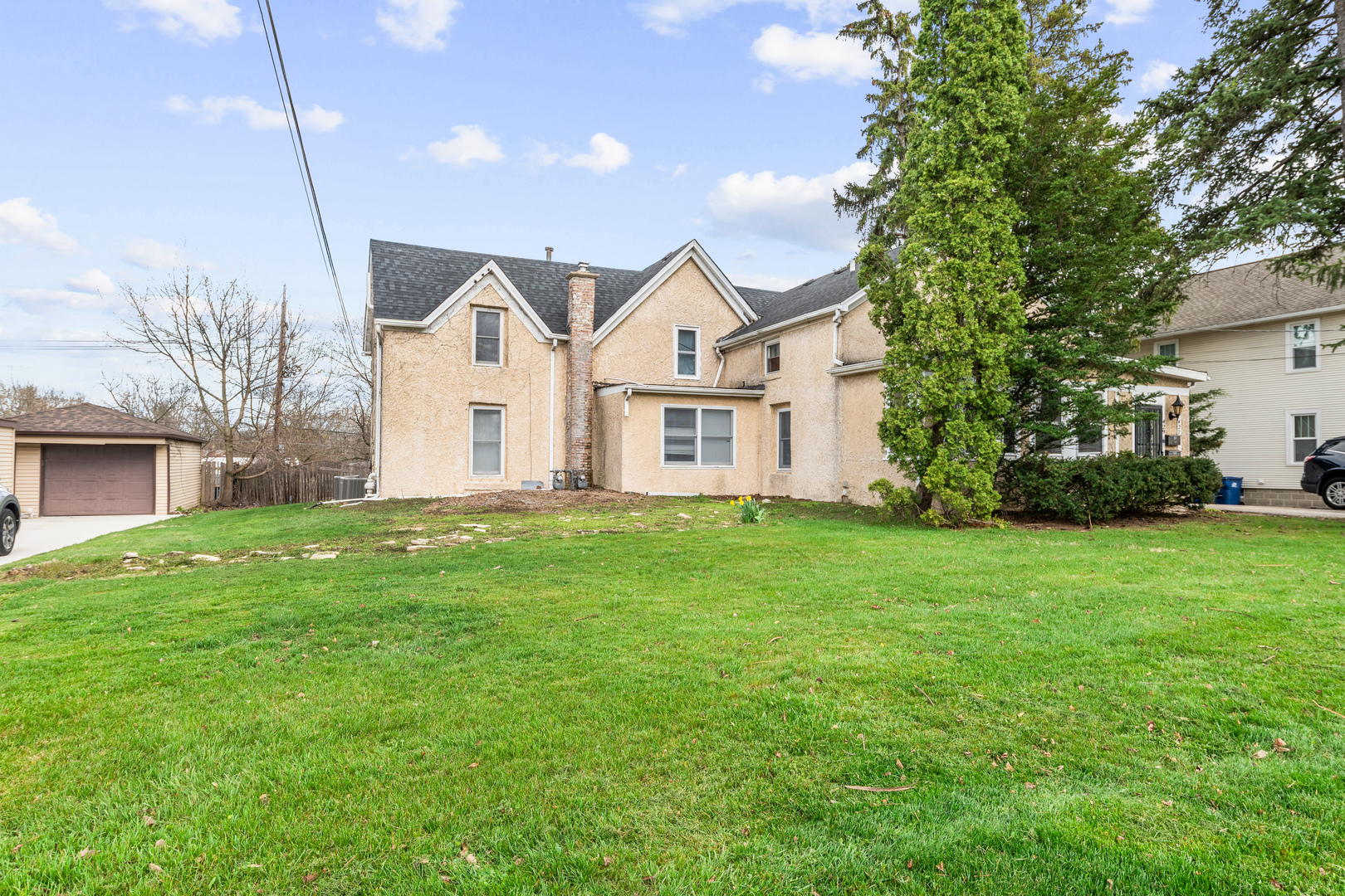 427 Delles Road Wheaton, IL 60187 - Photo 2 of 31 a front view of a house with a garden and yard