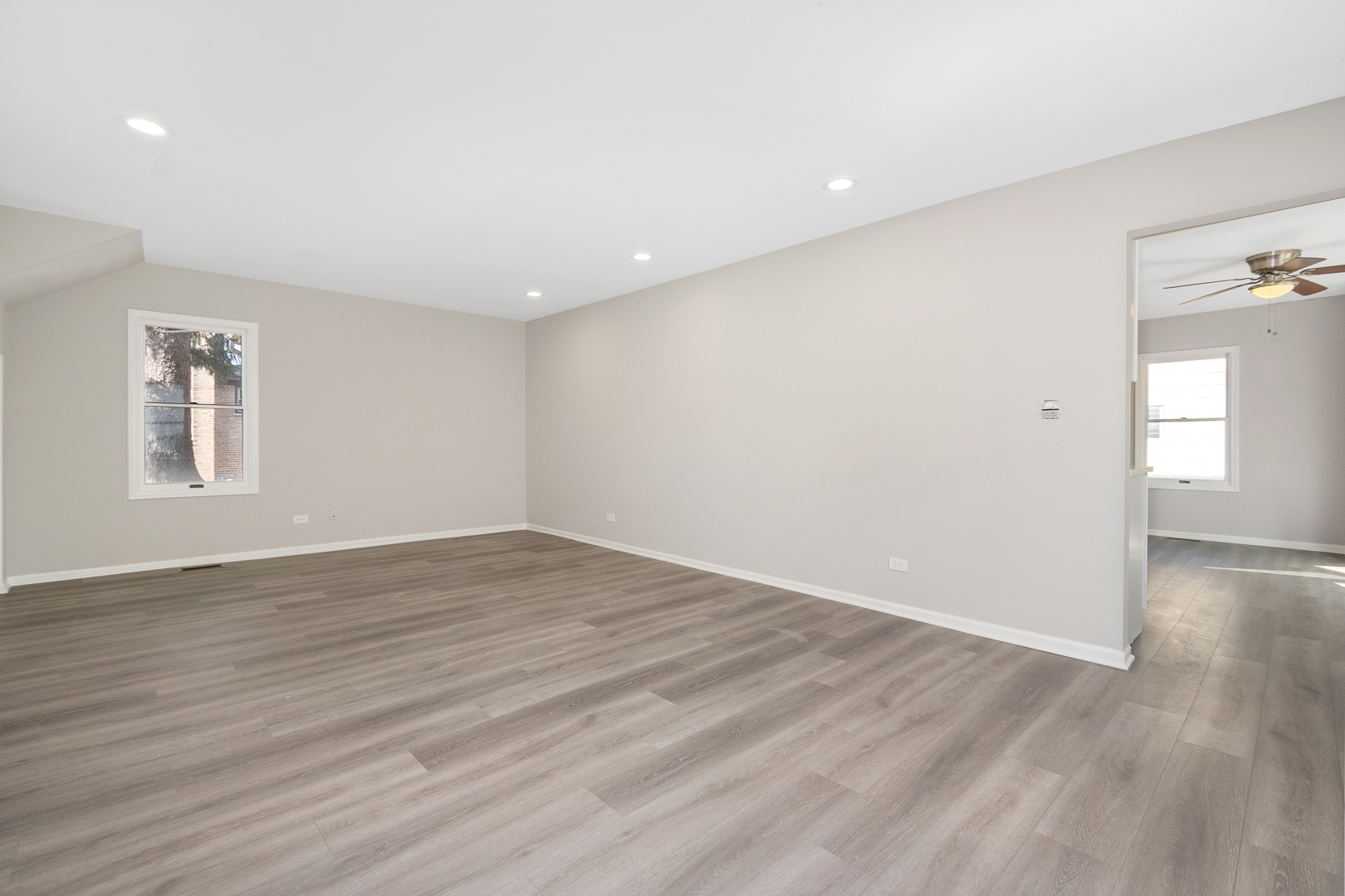 427 Delles Road Wheaton, IL 60187 - Photo 4 of 31 a view of empty room with wooden floor and fan