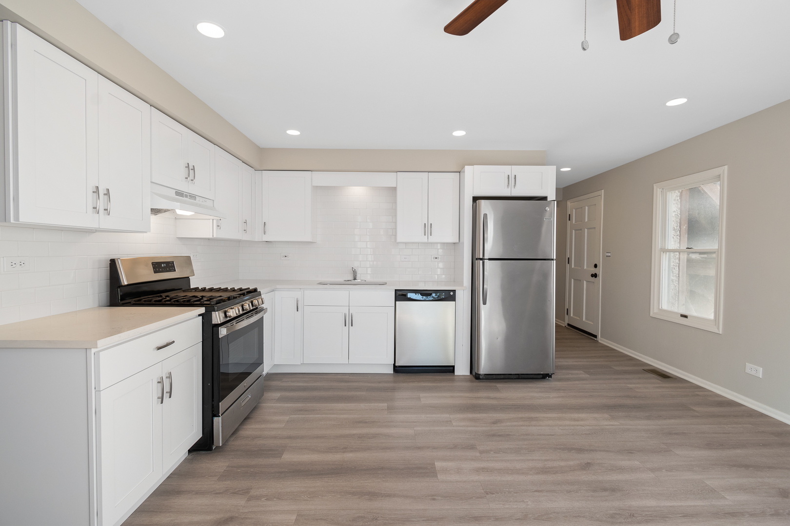 427 Delles Road Wheaton, IL 60187 - Photo 8 of 31 a kitchen with stainless steel appliances a refrigerator sink and cabinets