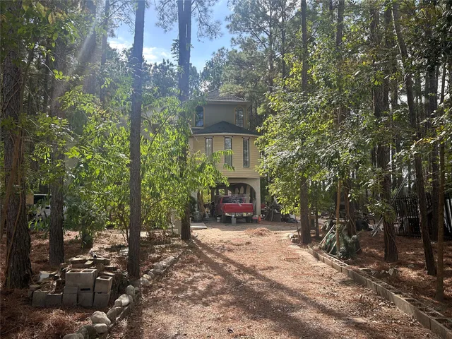 a view of a house with a tree