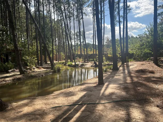 a view of an empty room with a fireplace