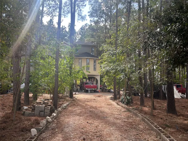 a view of house with trees in the background