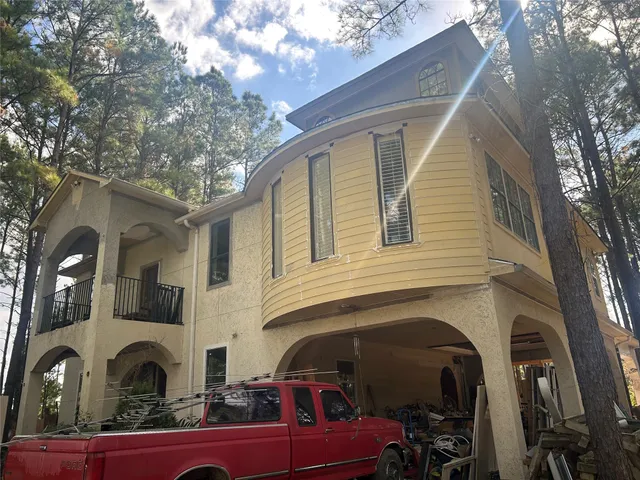 a view of a backyard with sitting area