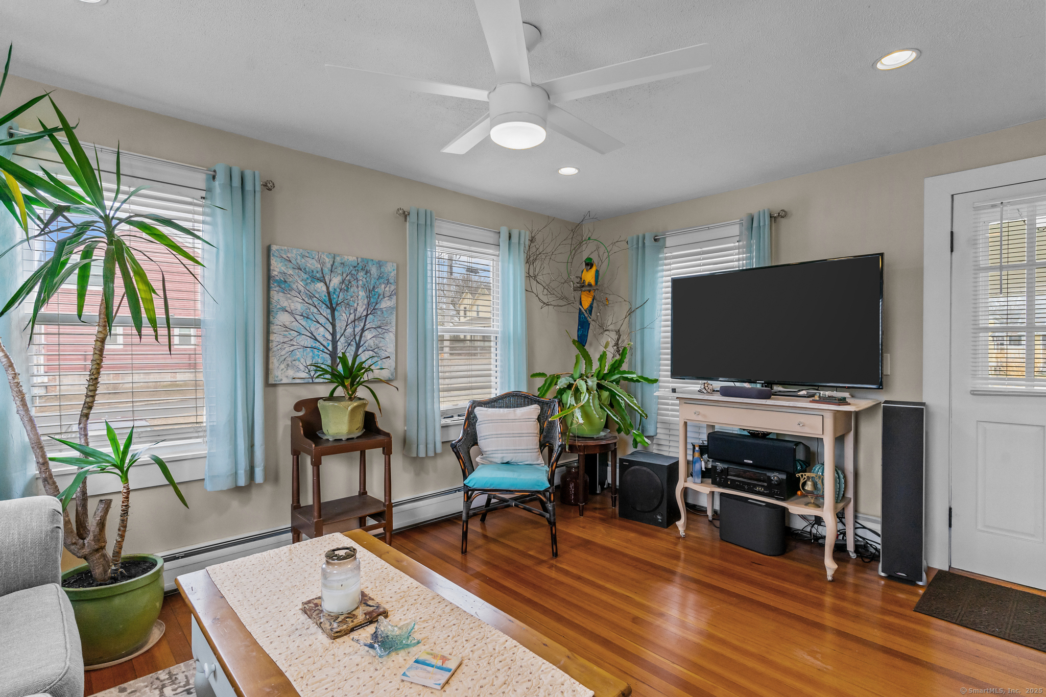 76 New Shore Road Waterford, CT 06385 - Photo 12 of 23 a living room with furniture and a flat screen tv